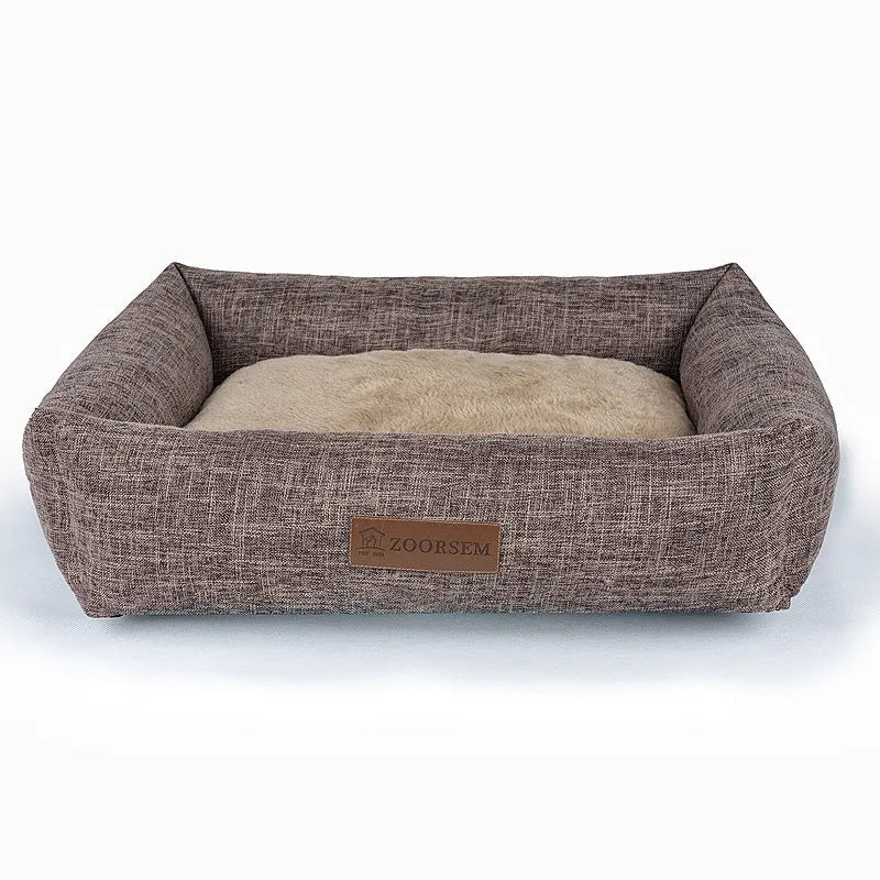 Grey linen-look square dog bed for medium-sized dogs on a wooden floor