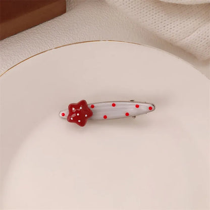 Red love heart-shaped hair barrette clip with retro white dots on a willow leaf-shaped base.