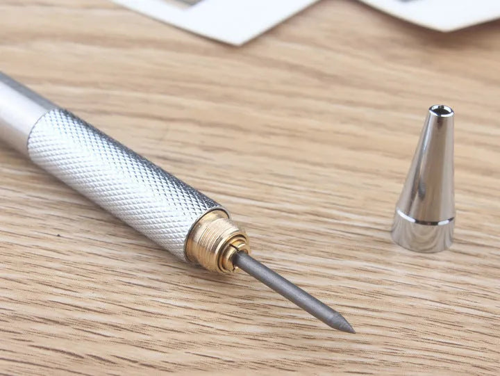 Metal automatic mechanical pencil showing multiple lead diameter options including 0.5 mm, 0.7 mm, 0.9 mm, 1.3 mm, and 2.0 mm