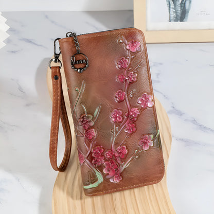 Chinese style embossed floral handbag with zip closure in black or brown colours
