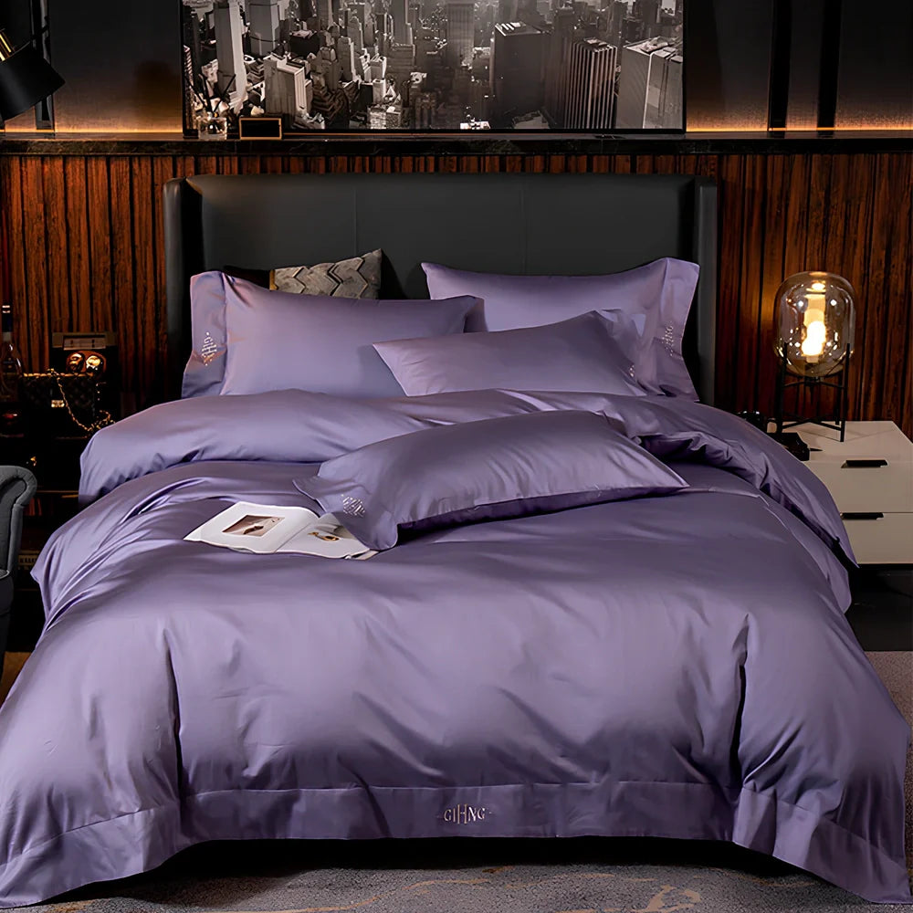Four-piece cotton bedding set with satin weave fabric showing quilting detail and colour options
