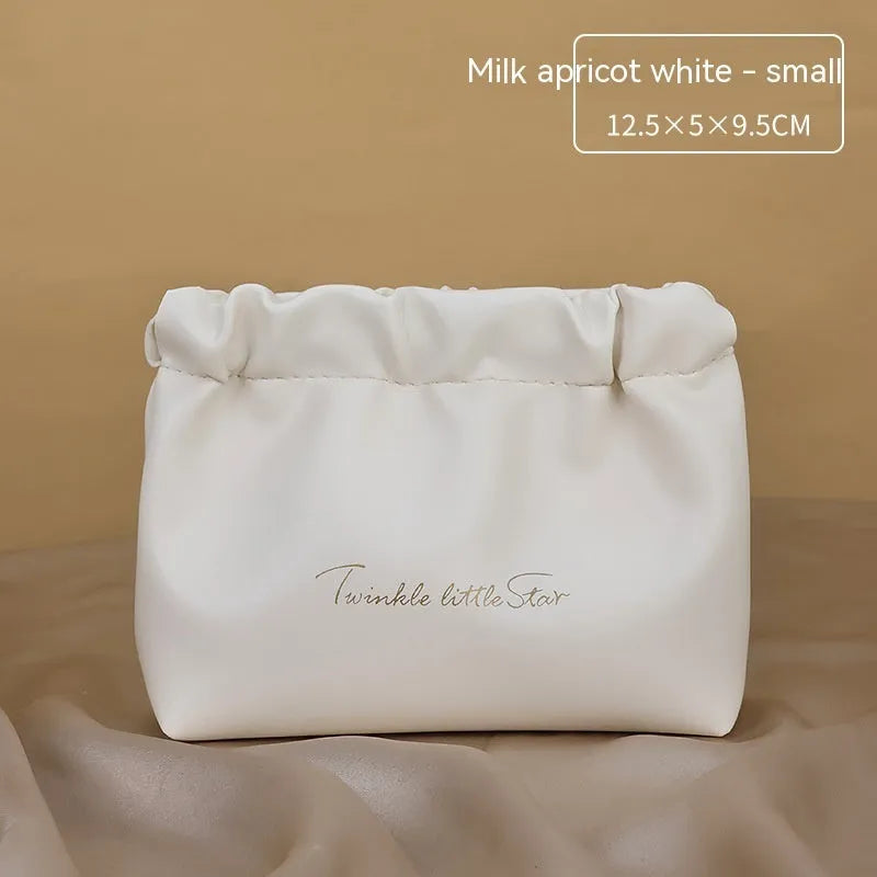 Leather travel toiletry bag with dry-wet separation compartments in caramel mocha colour