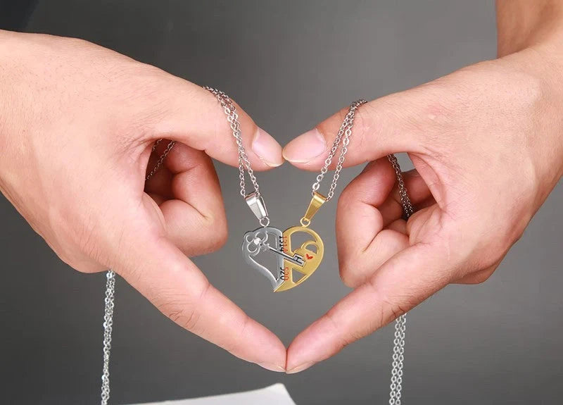 Captivating couples' love necklace set in gold, black, and silver colours with delicate chain and symbolic pendant design