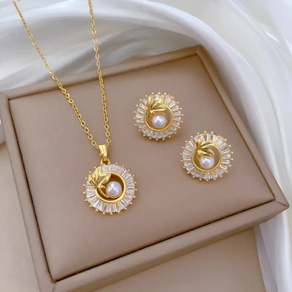 Women's geometric leaves design jewellery set with titanium steel necklace and gold plated stud earrings.