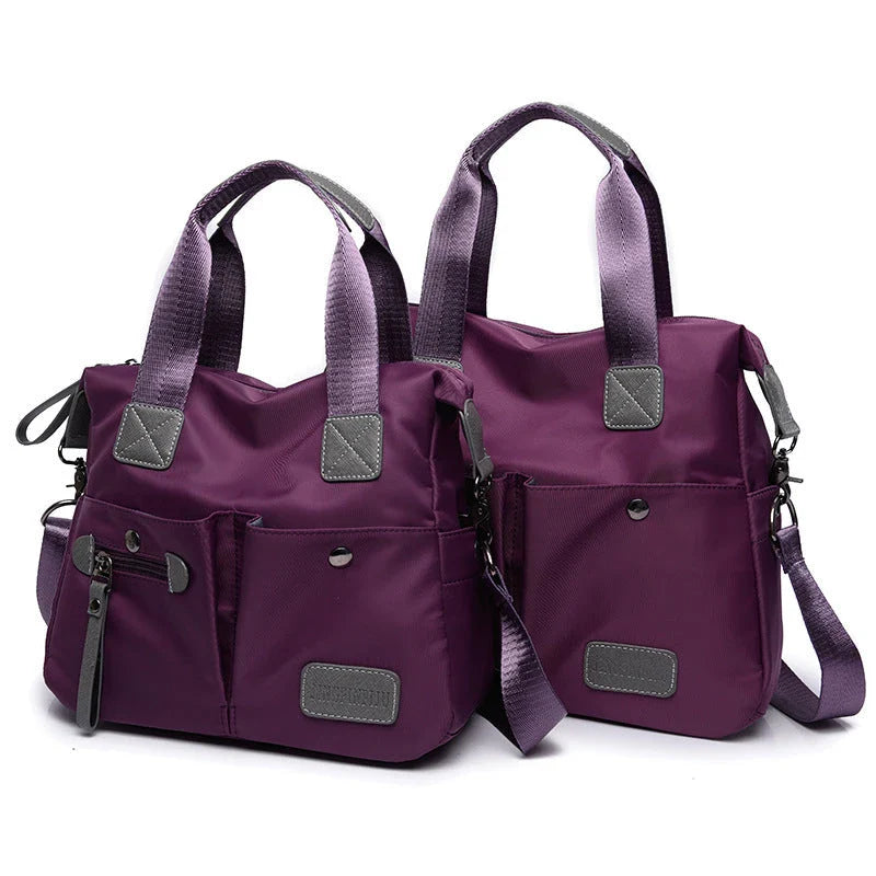 A fashionable and versatile ladies tote bag with multiple compartments and carrying options for the modern woman on the move.