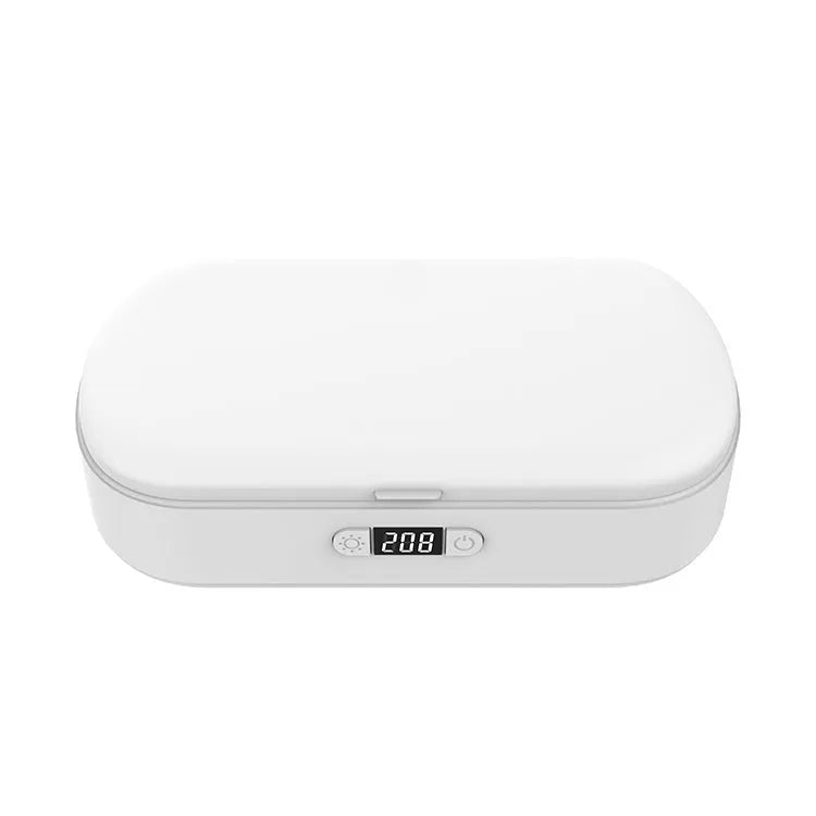White wireless UV steriliser and charging box for mobile phones and small personal items.