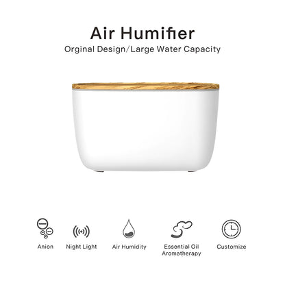 GX-22K white ultrasonic humidifier and aromatherapy diffuser unit with night light on a wooden surface.