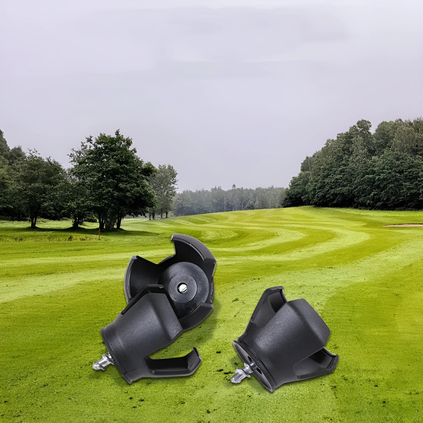 Black golf ball picking device clip shown on a golf bag strap.