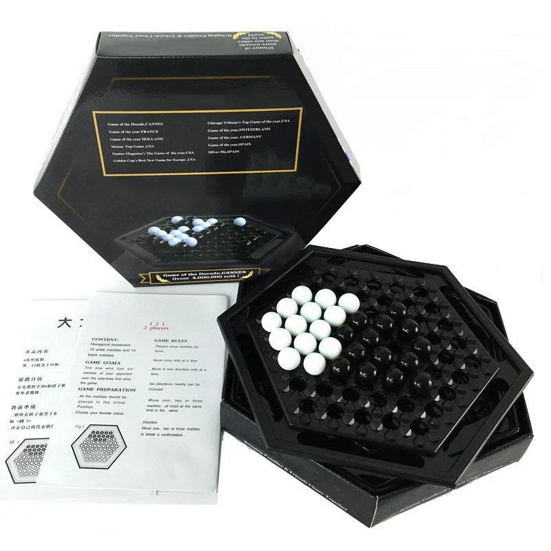 Abalone family board game with marble pieces on a wooden game board