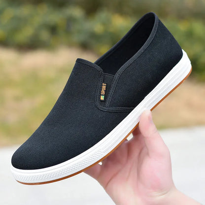 Men's low-top canvas cloth shoes with slip-on design and composite sole in black colour