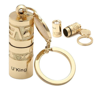 Gold zinc alloy keychain torch with LED light, shown attached to a keyring.