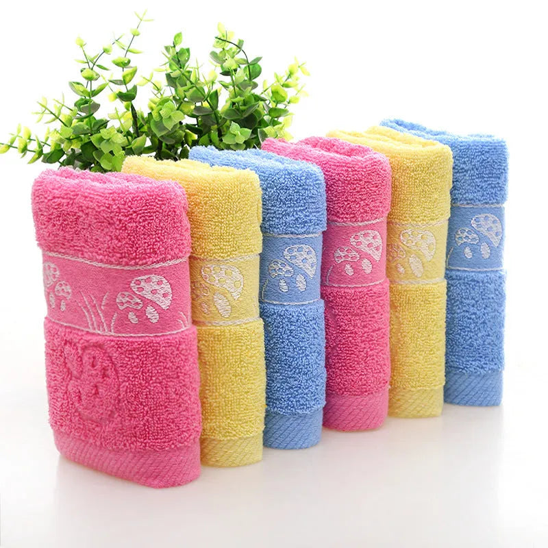 Cotton face towel in blue, pink and yellow colours with heart patterns, dimensions 73x33cm