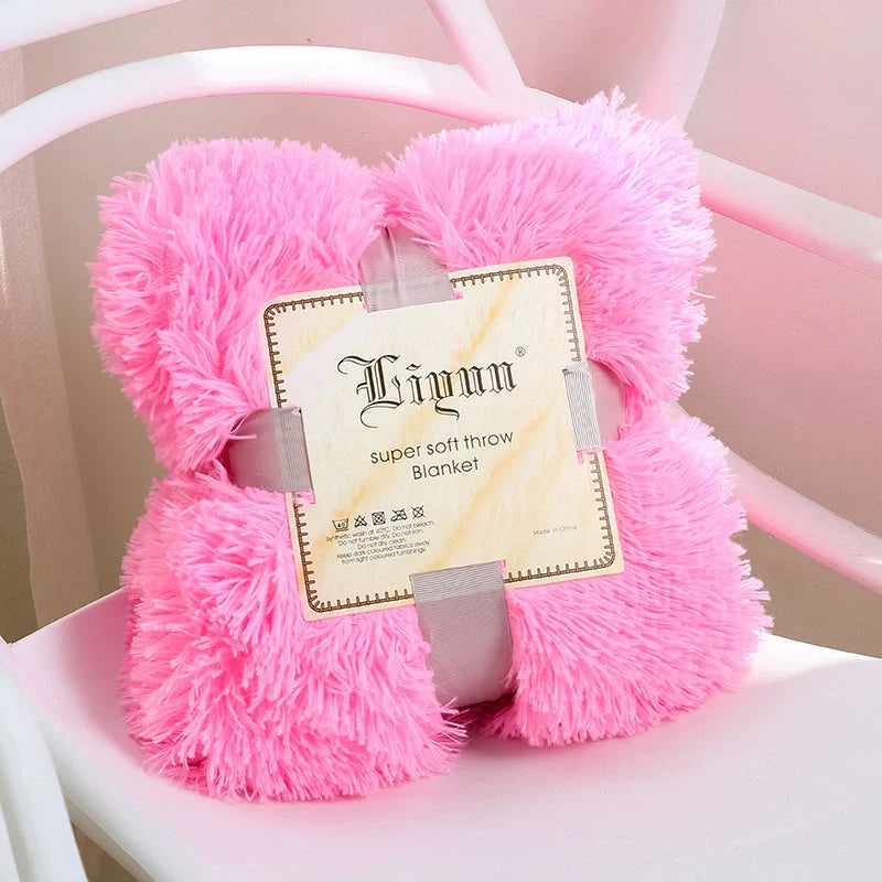 Soft coral fleece blanket in various colours and sizes for home and travel comfort