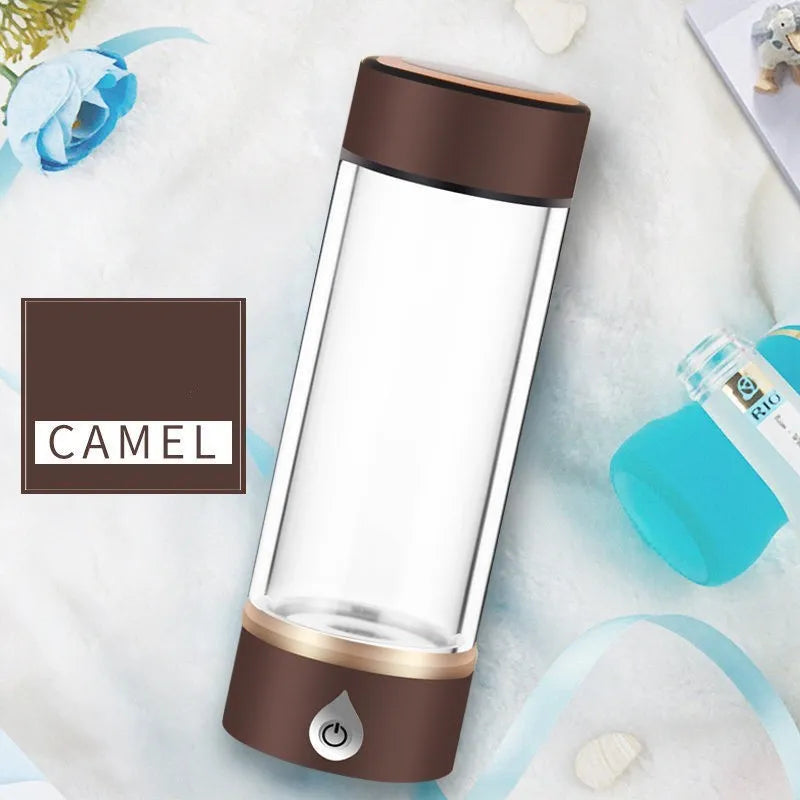 Portable hydrogen water ionizer bottle with high borosilicate glass cup in silver finish.