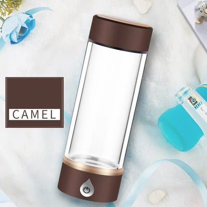 Portable hydrogen water ionizer bottle with high borosilicate glass cup in silver finish.