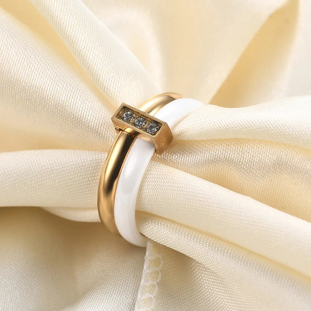Women's ceramic ring with geometric design, glossy stitching, and zirconium inlay in steel black or gold white finish