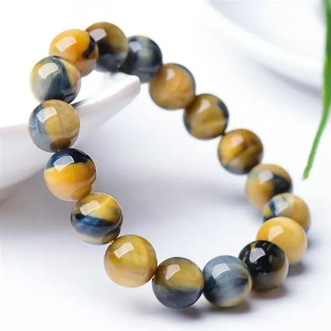 Fantasy tiger eye agate unisex bracelet with round beads in geometric single-circle design.