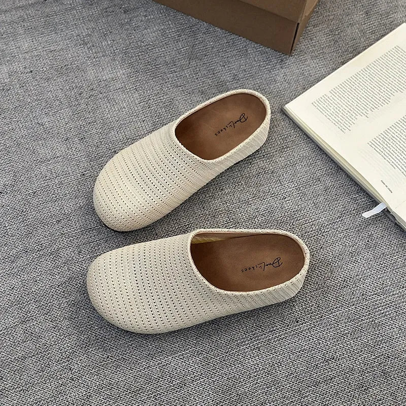 Baotou Boken women's cloth upper slippers with rubber sole in beige, shown in a leisure setting.