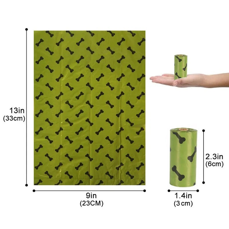 Roll of military green degradable dog poop bags with black bone print, shown next to a plastic dispenser.