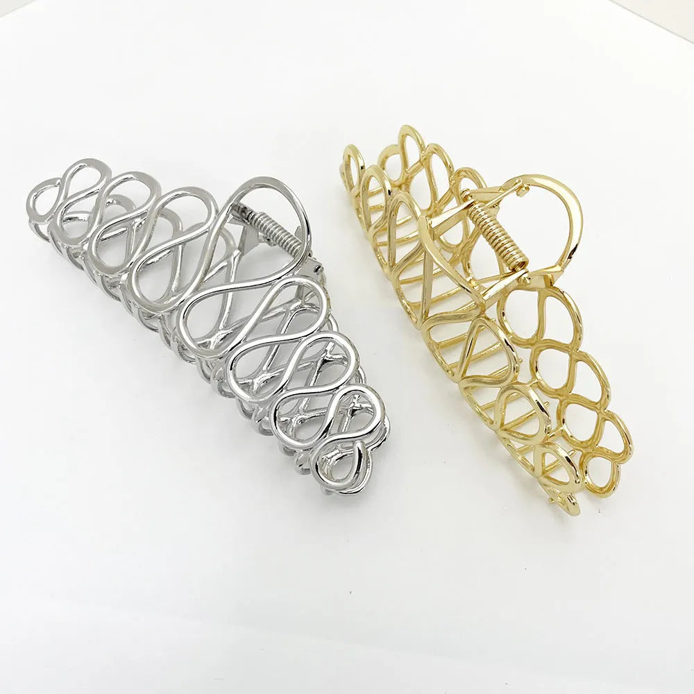 Large minimalist alloy hair clip with electroplated gold finish and irregular tassel decoration for creating updo hairstyles