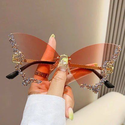 Chic butterfly-shaped sunglasses with diamond accents in various gradient color options