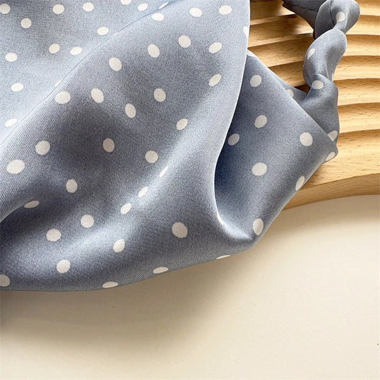 Elegant white satin triangle hair scarf with floral pattern, suitable for versatile styling as a headband, scarf, or bandana