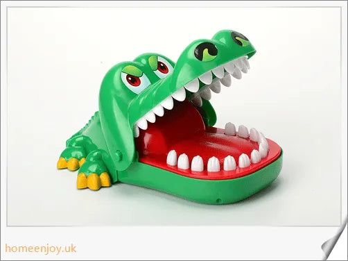 A bright green crocodile with big eyes and long teeth, ready to bite down on the dentist's tongs.