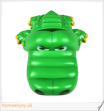 A bright green crocodile with big eyes and long teeth, ready to bite down on the dentist's tongs.