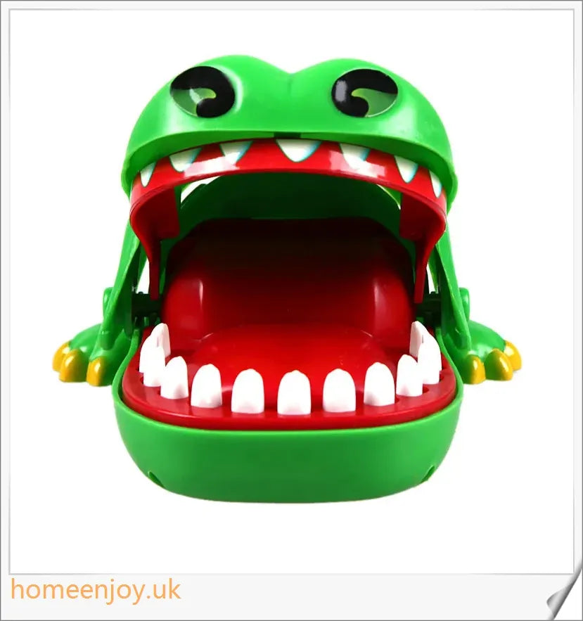 A bright green crocodile with big eyes and long teeth, ready to bite down on the dentist's tongs.