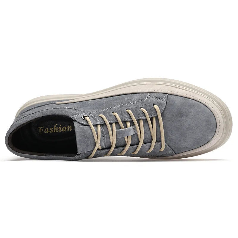 Men's grey low-top casual leather skate shoes with round toe and flat rubber sole on a neutral background.