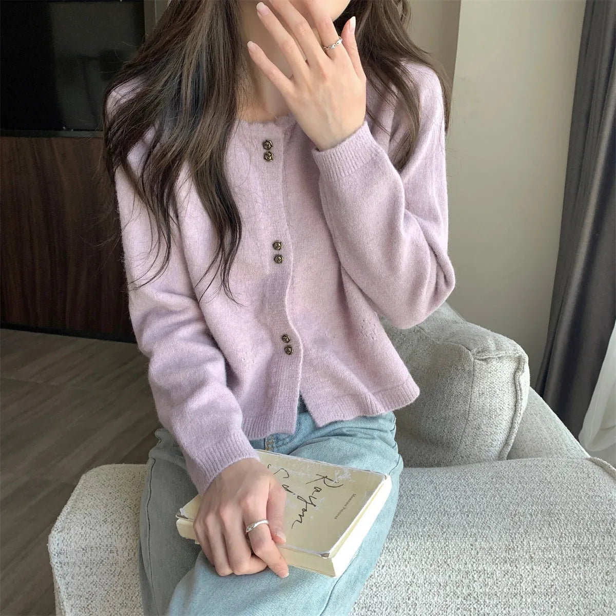 Women's milky white long sleeve acrylic cardigan sweater worn open, showing free size fit and regular sleeve design.
