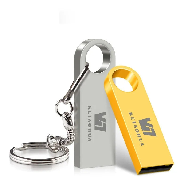 Custom silver metal car-shaped USB flash drive on a white background