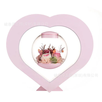 Pink preserved rose ornament with Bluetooth speaker and LED light on wooden table