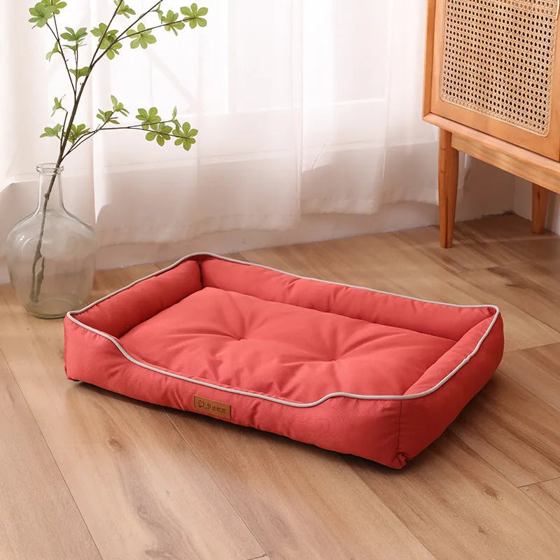 Waterproof dog sofa bed in grey Oxford cloth showing raised sides and rectangular shape