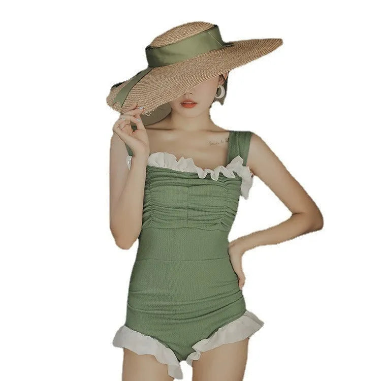 Women's black high-waisted one-piece swimsuit made from quick-drying polyester fabric.
