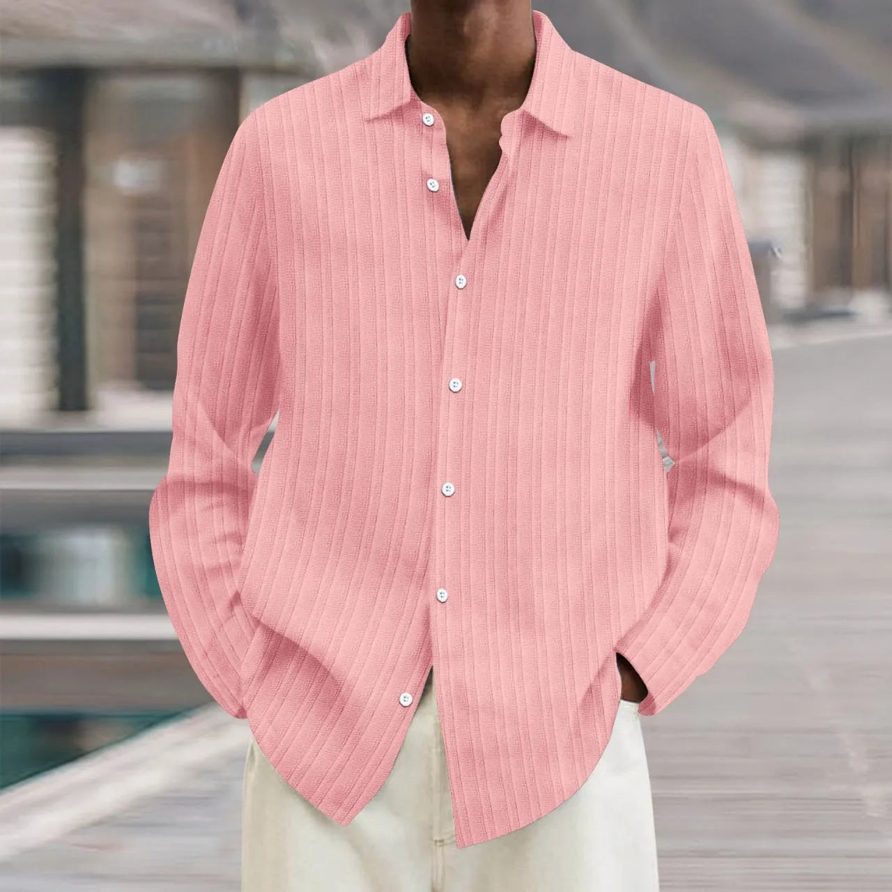 Man wearing a loose fit plain colour striped long sleeve cardigan shirt.