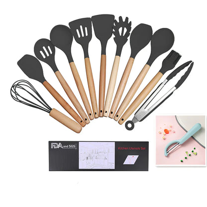 Dark grey silicone cooking utensils with wooden handles including spatula, spoon, whisk, and tongs