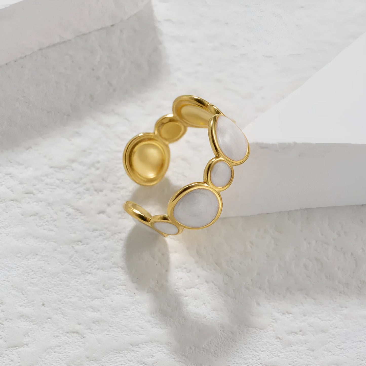 Adjustable geometric stainless steel ring showing angular design and opening mechanism