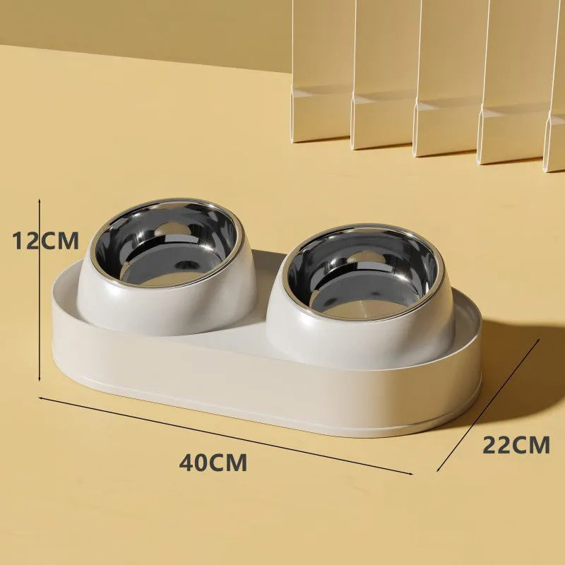 White elevated pet feeder with two tilted bowls on a non-slip base, for cat and small dog food and water.