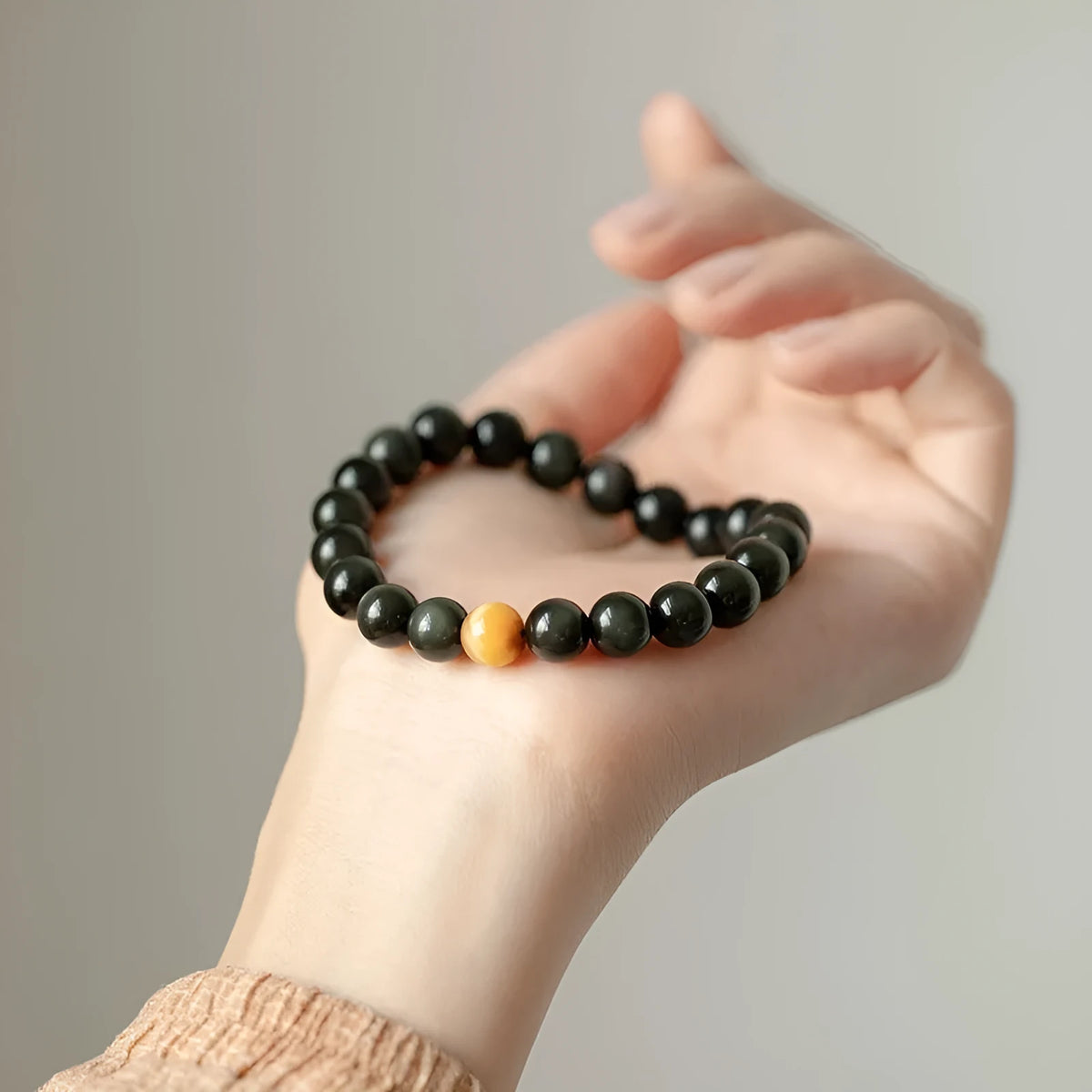 Black obsidian stone bracelet with geometric beads in unisex Korean style.