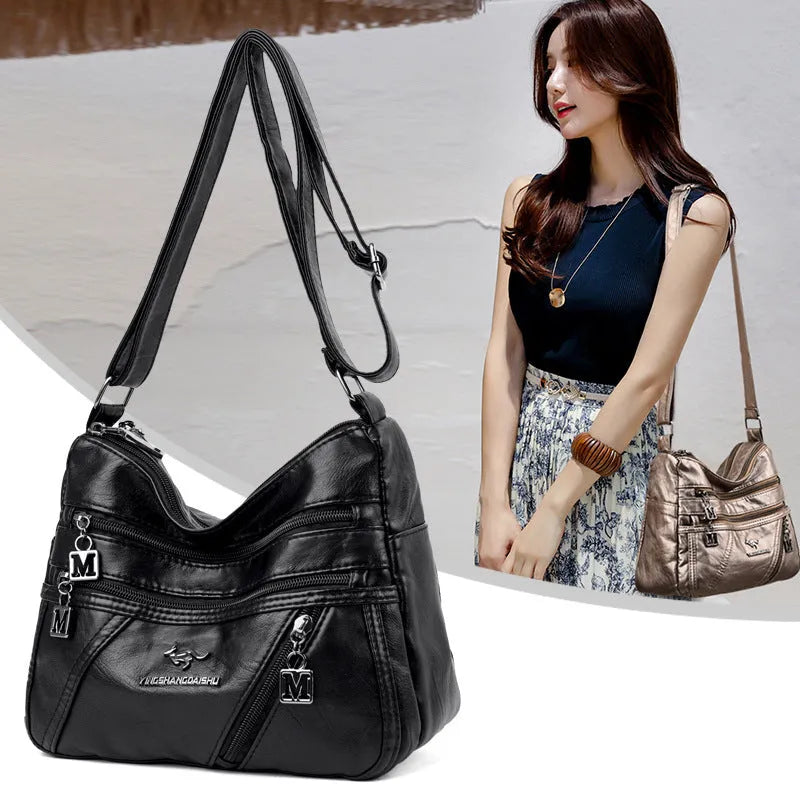 Middle-aged women's double layer PU shoulder bag with large capacity, welt pocket, and soft build in red, purple, dark blue, black, bronze, gray, or tan.
