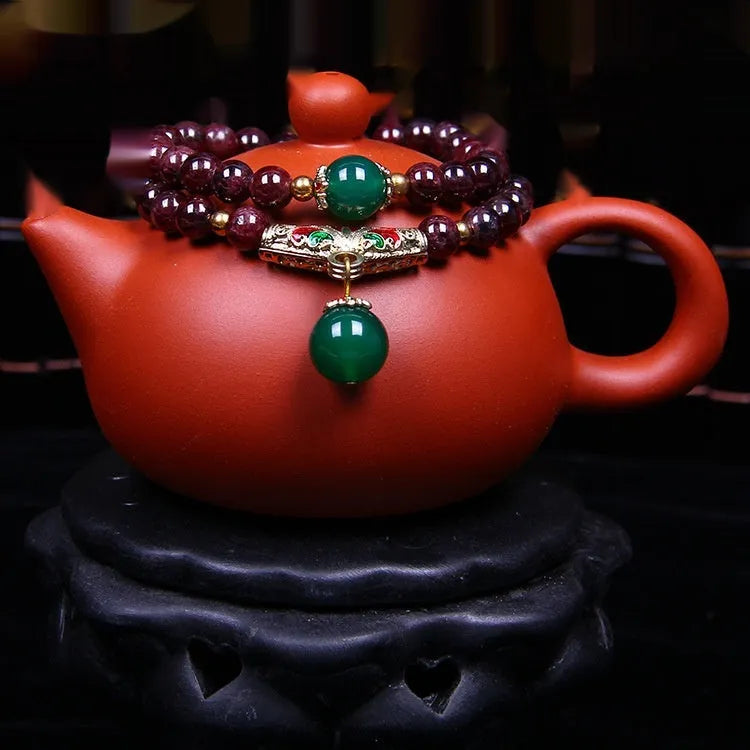 Natural garnet bracelet with 7mm stones, double ring design and golden toad charm