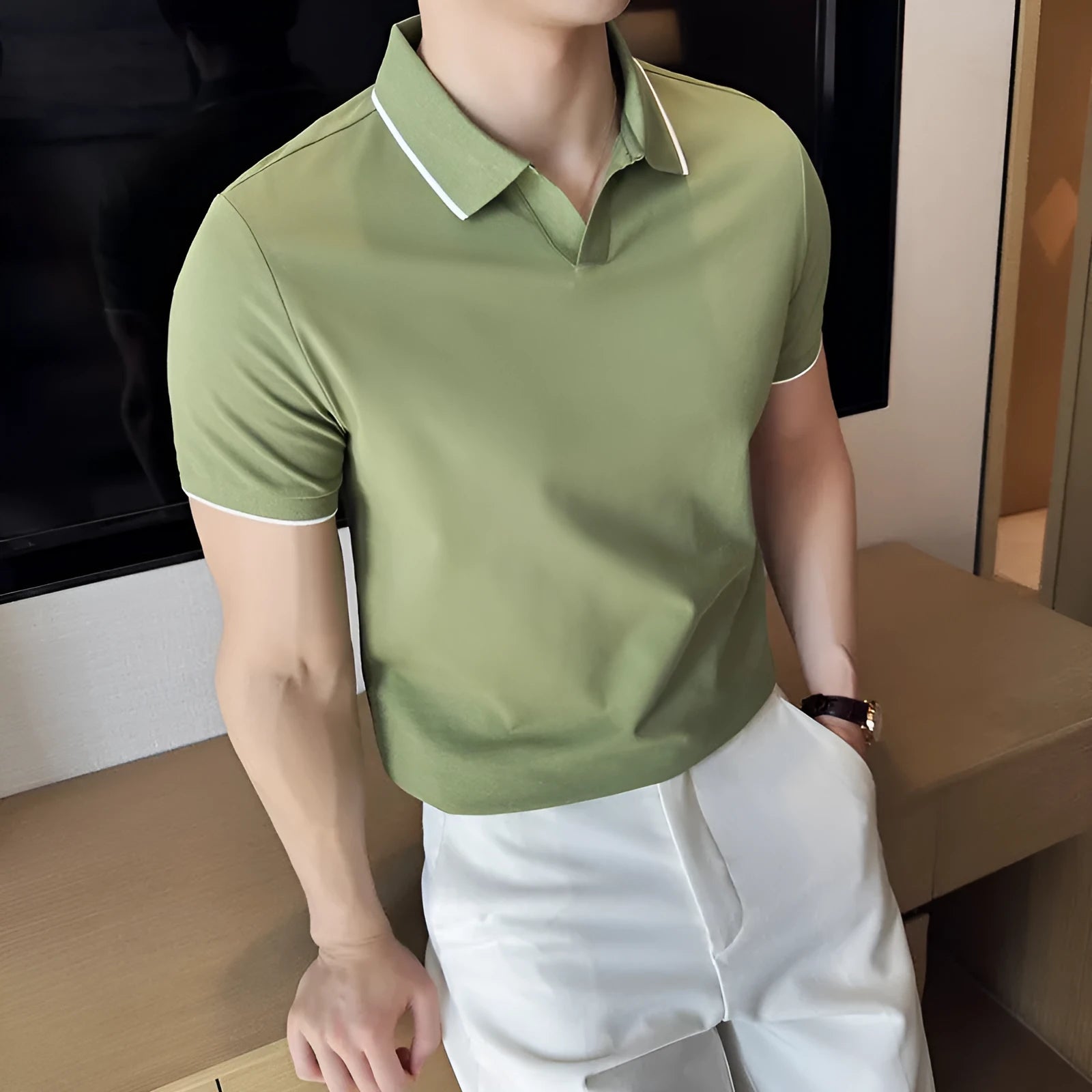 Men's solid colour short sleeve polo shirt with lapel collar on a hanger
