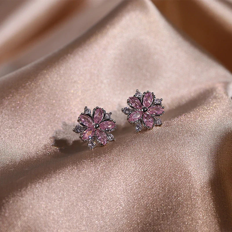 Dazzling cubic zirconia jewellery set with double-layered flower design, including ring, necklace, and earrings in pink and white diamond colours