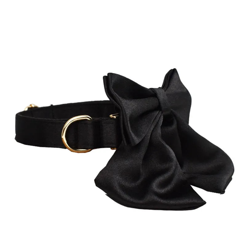 Cloth dog collar and leash set with chest strap harness, adjustable vest, and decorative bow.