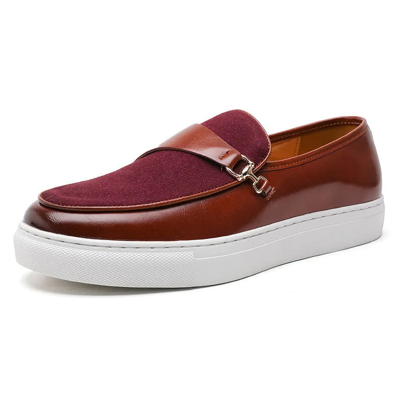 Men's black slip-on shoes with a gold horsebit buckle detail and round toe.