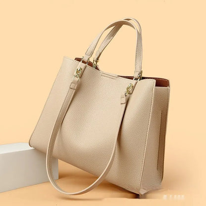 Women's messenger tote bag in horizontal square shape with crossbody strap and internal compartments