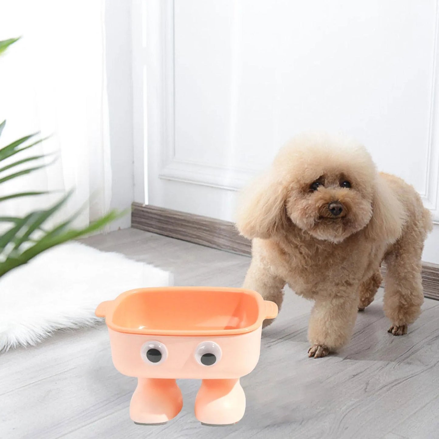 Robot-shaped elevated cat bowl with 15 degree tilt in green colour with detachable inner bowl