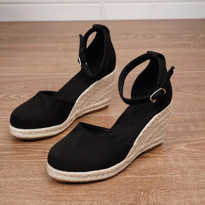 Women's Roman-style wedge sandals in suede with buckle fastening, shown in apricot and black colours