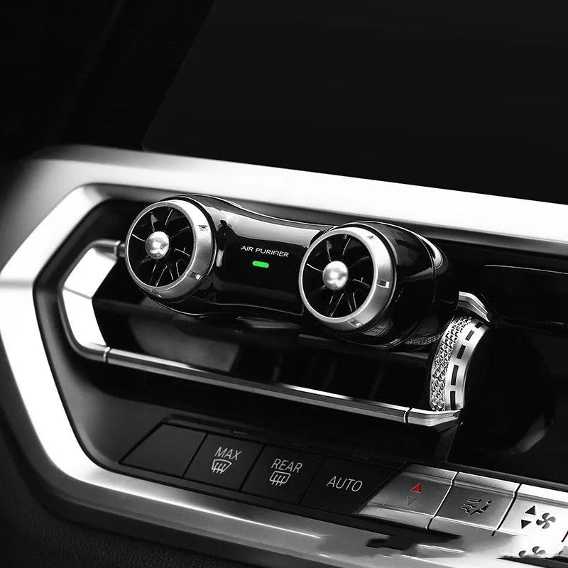 Compact black car anion air purifier with USB cable for formaldehyde removal and deodorising.